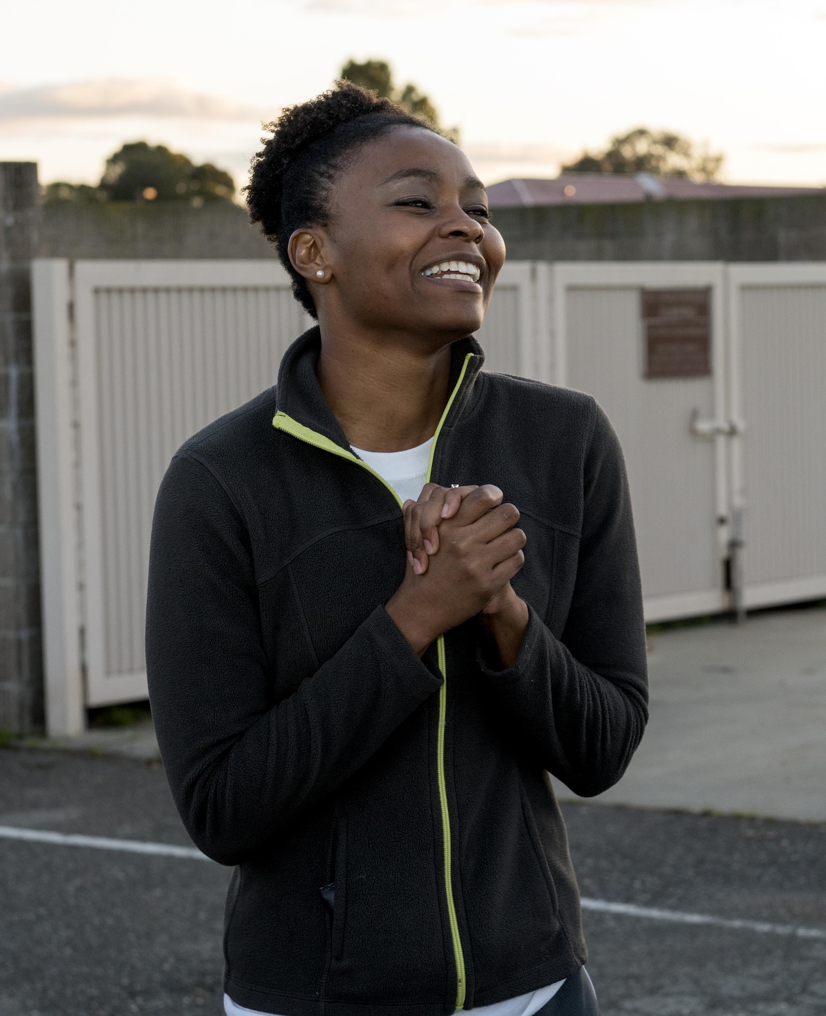 Capt. Aisha Lockett, 60th Force Support Squadron, welcomes participants to the Assistance Fund (AFAF) kick off and fun run, Mar. 27, 2017, Travis Air Force Base, Calif. Lockett helped to organize the event that was attended by more than 200 people. The kick off was held to raise awareness about the AFAF mission; supporting Air Force families in need, covering active duty, retirees, reservists, guard, dependents, and surviving spouses.(U.S. Air Force photo/ Heide Couch)
