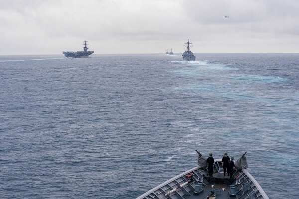 The guided missile cruiser USS Princeton sails behind the aircraft carrier USS Nimitz, left, and guided missile destroyers USS Shoup, USS Howard and USS Pinckney during a straits transit exercise while underway for a composite training unit exercise. Navy photo by Seaman Kelsey J. Hockenberger