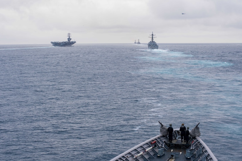 The guided missile cruiser USS Princeton sails behind the aircraft carrier USS Nimitz, left, and guided missile destroyers USS Shoup, USS Howard and USS Pinckney during a straits transit exercise while underway for a composite training unit exercise. Navy photo by Seaman Kelsey J. Hockenberger