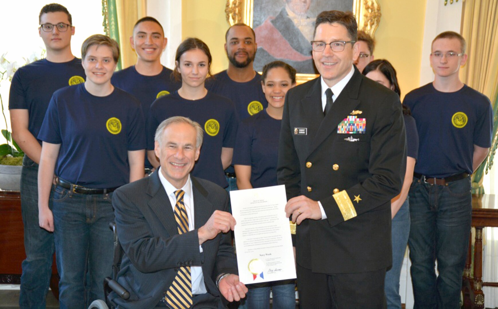 Texas Governor Greg Abbott delivers a proclamation to Navy Vice Chief of Information Rear Adm. Robert Durand after administrating the Oath of Enlistment to 10 future Sailors of Navy Recruiting District San Antonio at the governor’s mansion during Navy Week. Texas’s capital is hosting members of the U.S. Navy during Austin Navy Week, March 18-24, coinciding with Rodeo Austin and Stock Show. Austin Navy Week is the second of 15 Navy Weeks in 2017 which focus a variety of assets, equipment, and personnel on a single city for a weeklong series of engagements designed to bring America's Navy closer to the people it protects.