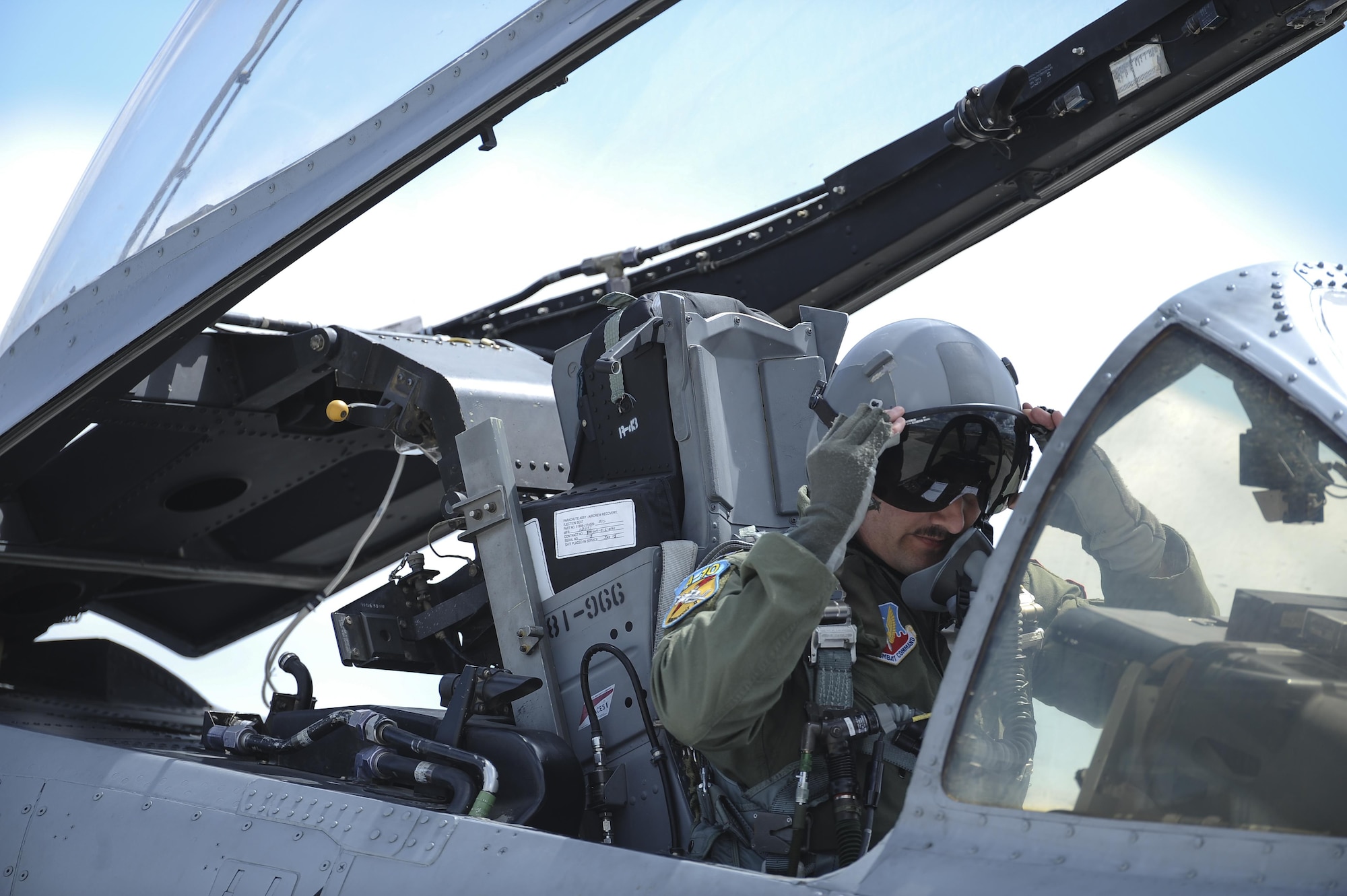 U.S. Air Force Capt. Chad Rudolph, 357th Fighter Squadron and A-10 West Heritage Flight Team pilot, puts on his goggles before takeoff during the Los Angeles County Air Show in Lancaster, Calif., March 25, 2017. This is the team’s first air show performance after nearly five years of disbandment. (U.S. Air Force photo by Airman 1st Class Mya M. Crosby)
