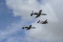 Two U.S. Air Force A-10C Thunderbolt IIs, assigned to the 354th Fighter Squadron and a part of the A-10 West Heritage Flight Team, and a P-38 Lightning fly in formation during the Los Angeles County Air Show in Lancaster, Calif., March 25, 2017. This is the team’s first air show performance after nearly five years of disbandment. (U.S. Air Force photo by Airman 1st Class Mya M. Crosby)