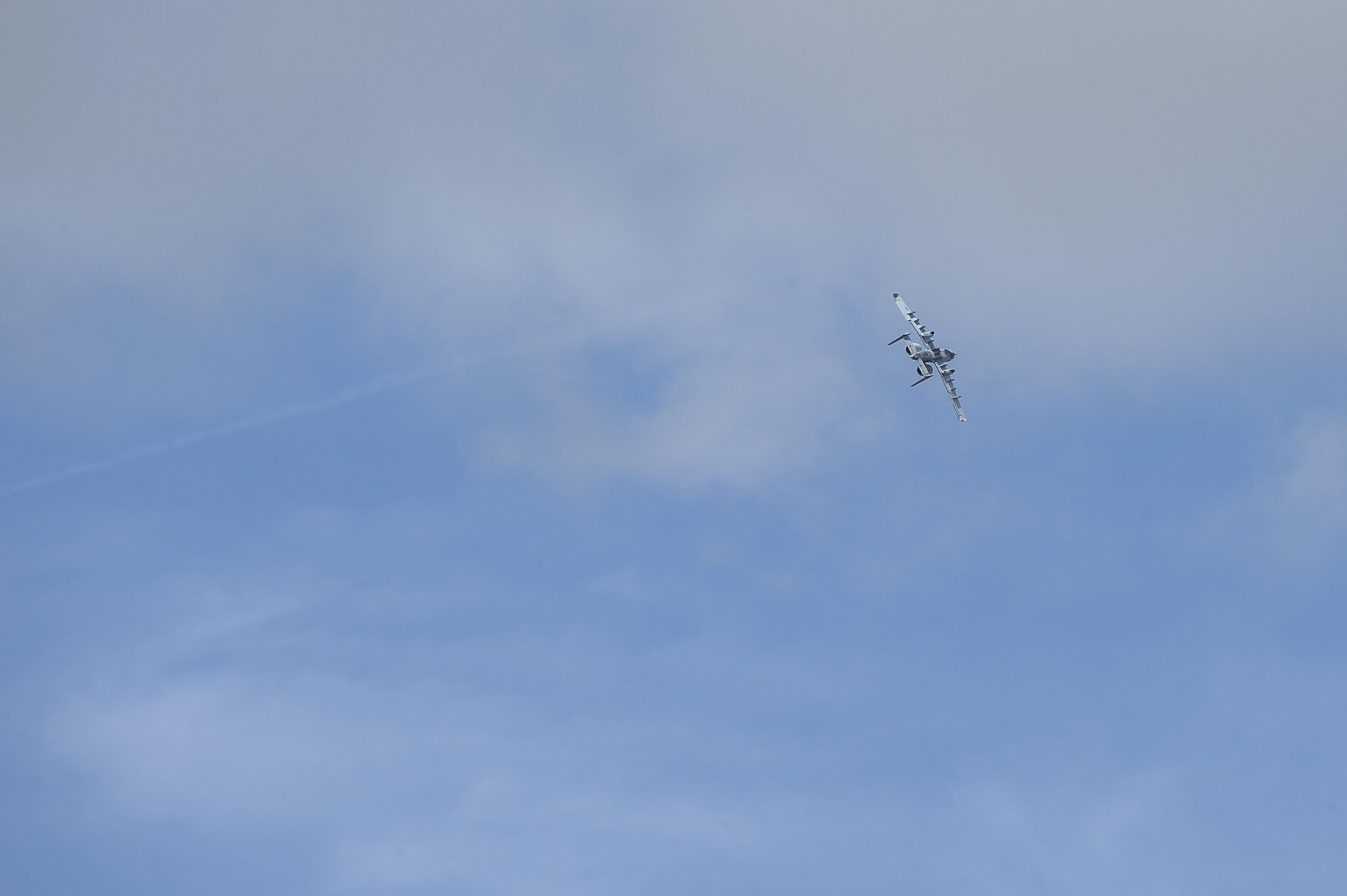 A U.S. Air Force A-10C Thunderbolt II from the A-10 West Heritage Flight Team performs a clockwise roll during the Los Angeles County Air Show in Lancaster, Calif., March 25, 2017. The A-10 WHFT is scheduled to perform in 9 more air shows throughout the U.S. this year. (U.S. Air Force photo by Airman 1st Class Mya M. Crosby)