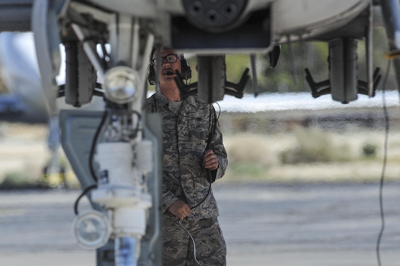 U.S. Air Force Senior Airman Jeff White, A-10 West Heritage Flight Team and 355th Maintenance Squadron crew chief, performs a pre-flight inspection during the Los Angeles County Air Show in Lancaster, Calif., March 26, 2017. The A-10 WHFT is scheduled to perform in 9 more air shows throughout the U.S. this year after resurging from a 5-year-long inactivation period. (U.S. Air Force photo by Airman 1st Class Mya M. Crosby)