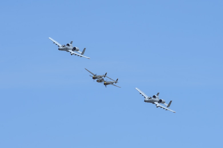 Two U.S. Air Force A-10C Thunderbolt IIs, assigned to the 354th Fighter Squadron and a part of the A-10 West Heritage Flight Team, and a P-38 Lightning fly in formation during the Los Angeles County Air Show in Lancaster, Calif., March 26, 2017. This is the team’s first air show performance after nearly five years of disbandment. (U.S. Air Force photo by Airman 1st Class Mya M. Crosby)
