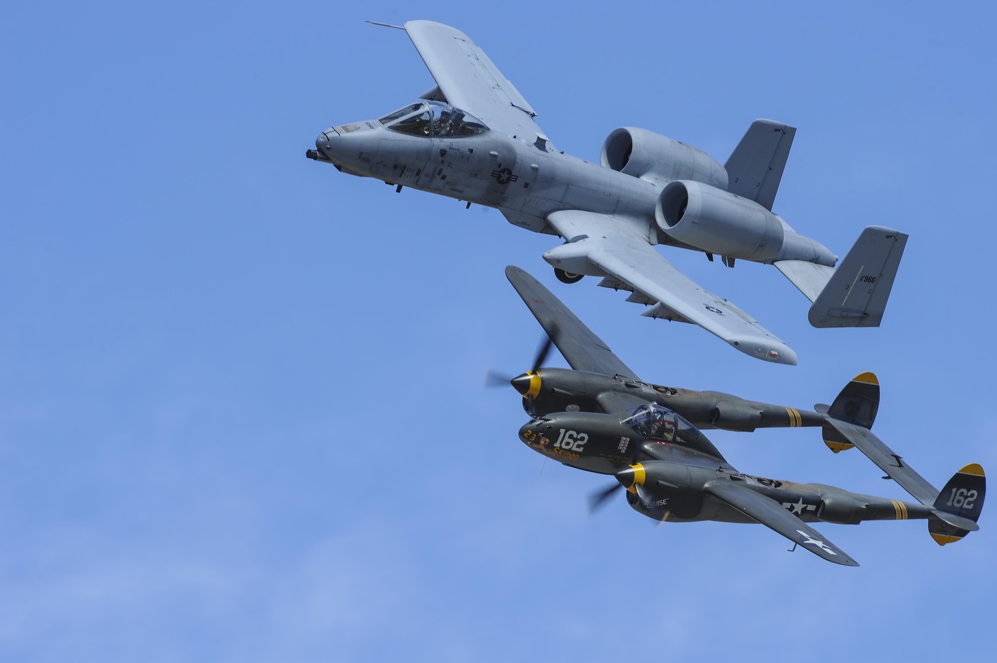 A U.S. Air Force A-10C Thunderbolt II, assigned to the 354th Fighter Squadron and a part of the A-10 West Heritage Flight Team, and a P-38 Lightning fly in formation during the Los Angeles County Air Show in Lancaster, Calif., March 26, 2017. The A-10 WHFT is scheduled to perform in 9 more air shows throughout the U.S. this year after resurging from a 5-year-long inactivation period. (U.S. Air Force photo by Airman 1st Class Mya M. Crosby)