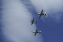Two U.S. Air Force A-10C Thunderbolt IIs, assigned to the 354th Fighter Squadron and a part of the A-10 West Heritage Flight Team, and a P-38 Lightning fly in formation during the Los Angeles County Air Show in Lancaster, Calif., March 26, 2017. This is the team’s first air show performance after nearly five years of disbandment. (U.S. Air Force photo by Airman 1st Class Mya M. Crosby)