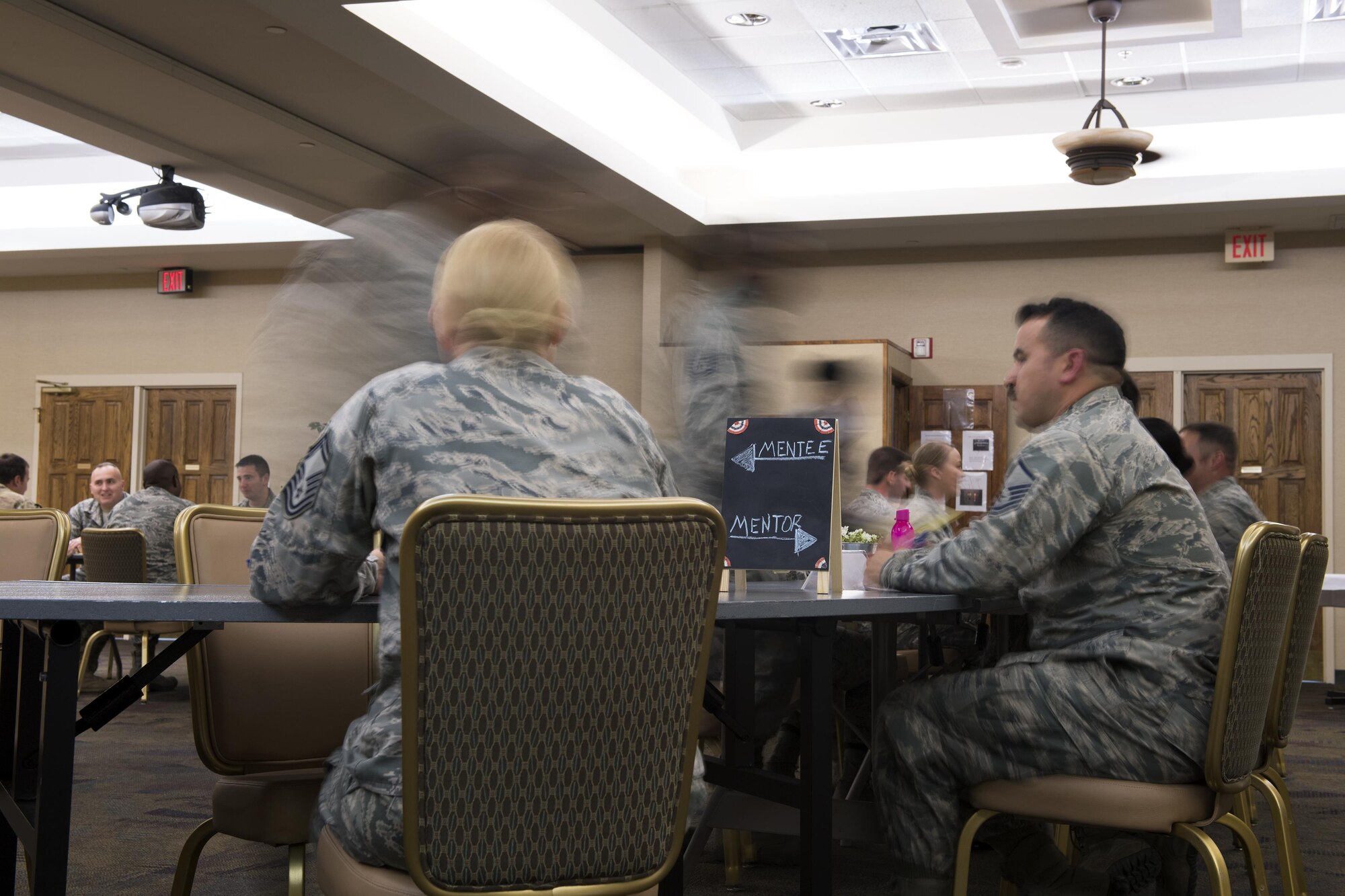 Airmen move to their next mentor during The Top 3 speed mentoring event, March 23, 2017 at Moody Air Force Base, Ga. The event gave NCOs the opportunity to ask for advice and guidance from Senior NCOs in a variety of career fields on base. NCOs were encouraged to bring paperwork or supporting documents to give SNCOs more resources to try to help. (U.S. Air Force photo by Airman 1st Class Janiqua P. Robinson)
