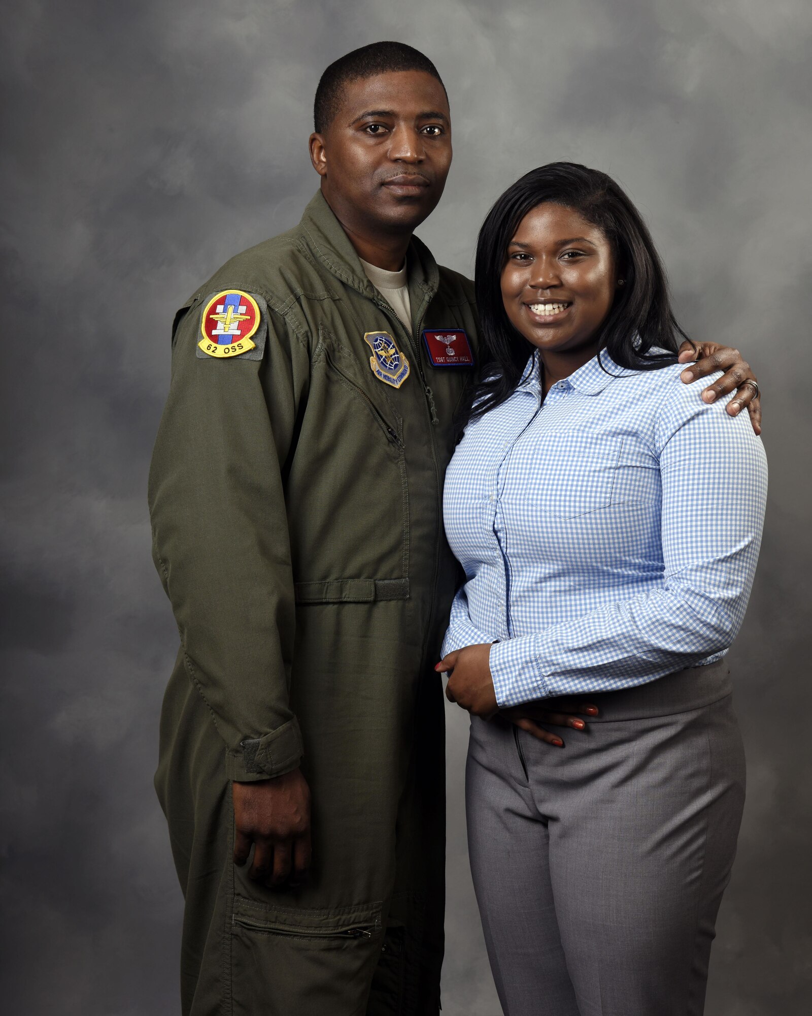 Tech. Sgt. Quincy Hall, 62nd Operations Support Squadron loadmaster, poses with his daughter, Nyah Hall, March 28, 2017 at Joint Base Lewis-McChord, Wash. Nyah, a sophomore at Clover Park High School who aspires to be an Air Force flight nurse, was named Washington State Military Youth of the Year during a Boys and Girls Club event, March 23, 2017 in Seattle. (U.S. Air Force photo/Staff Sgt. Whitney Amstutz)