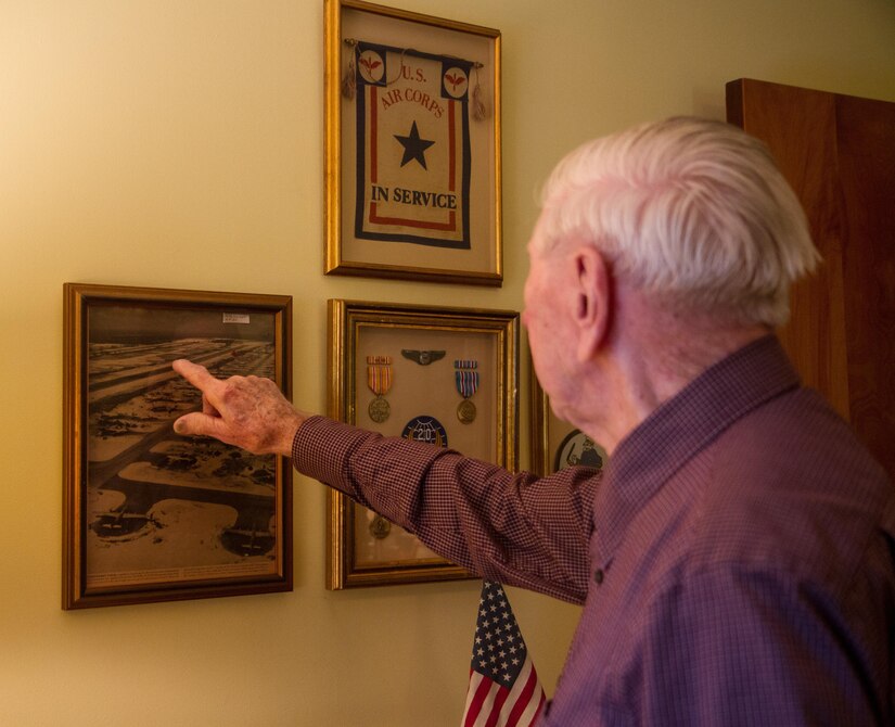 William Dellinger, a 96-year-old veteran and native of Charlotte North Carolina reminisces on events during WWII, things he’s seen and the life he has lead, at his home Wednesday, Nov 2. Dellinger points at the B29 aircraft that he primarily used during the War. (U.S. Army Photo by Spc. Tynisha Daniel, 108th Training Command)