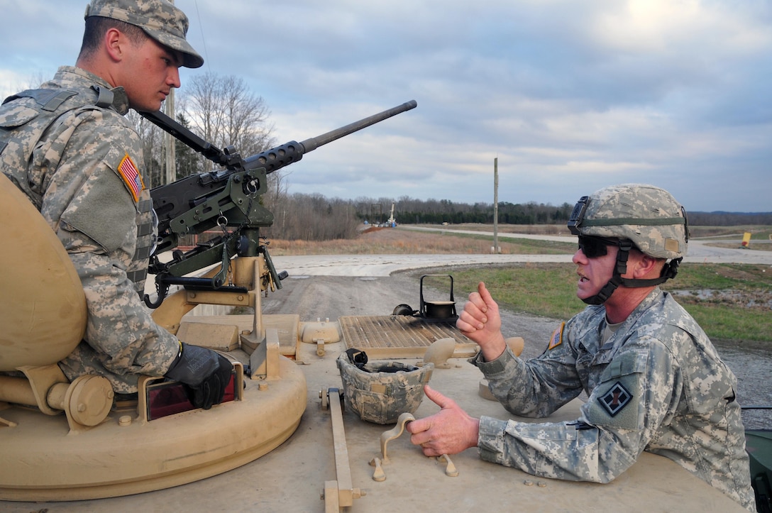 U.S. Army Reserve !st. Sgt. Ralph Class, 979th Mobility Augmentation Company, 478th Engineer Battalion, 926th Engineer Brigade, 412th Theater Engineer Command, based in Lexington, Ky., offers some advice to Spc. Johnny Jarreett before he and his crew leave the ammunition point and participate in a Gunnery crew live-fire qualification at Wilcox Range on Fort Knox, Ky., March 28, 2017. This is the first time that this company has fired its M2s and M240B Machine Guns from M113 Armored Personnel Carriers. This training ensures that Army Reserve units and Soldiers bring combat-ready and lethal firepower to worldwide operations. (U.S. Army Reserve Photo by Sgt. 1st Class Clinton Wood)