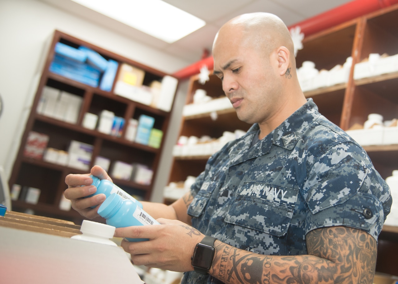 Navy Petty Officer 3rd Class Sherwin Mora, a hospital corpsman, conducts his weekly inspection of the pharmacy in the Branch Medical Clinic at Naval Base Guam. Navy photo
