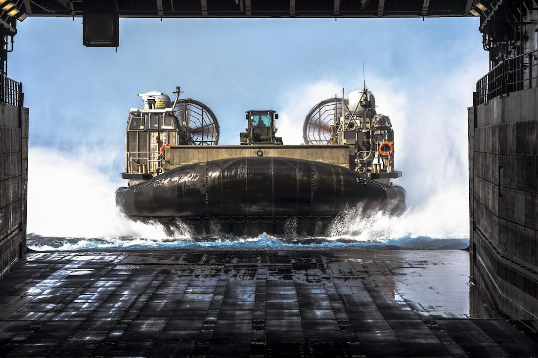 An air-cushioned landing craft approaches the well deck of the USS Green Bay in Kinbu Bay, Japan, March 28, 2017. The ship is operating in the Indo-Asia-Pacific region to enhance warfighting readiness for any type of contingency. Navy photo by Petty Officer 2nd Class Kaleb R. Staples