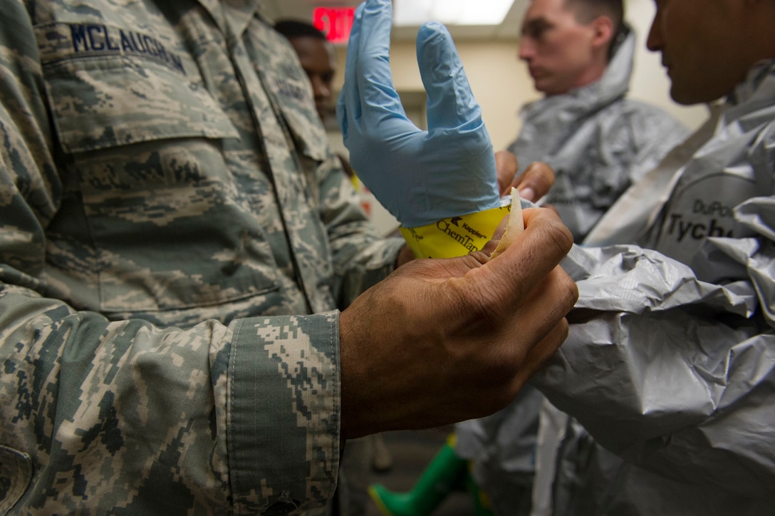 Airmen from the 779th Aerospace Medicine Squadron’s bioenvironmental flight change into suits for handling hazardous material during a training exercise at Joint Base Andrews, Md., Jan.18, 2017. The flight conducts routine training to remain proficient and ready to respond at a moment’s notice. Air Force photo by Senior Master Sgt. Adrian Cadiz