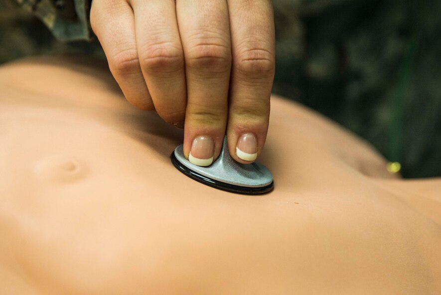 Tech. Sgt. Emily Irwin-Green, St. Louis Center for Sustainment of Trauma and Rediness Skills emergency and trauma nursing instructor, assess a simulated patient at the Sisters of St. Mary Hospital in St. Louis, Missouri on March 20, 2017. The SSM Health St. Louis University Hospital is an academic medical center that serves as a teaching hospital for SLU School of Medicine. (U.S. Air Force Photo by Airman 1st Class Daniel Garcia)

