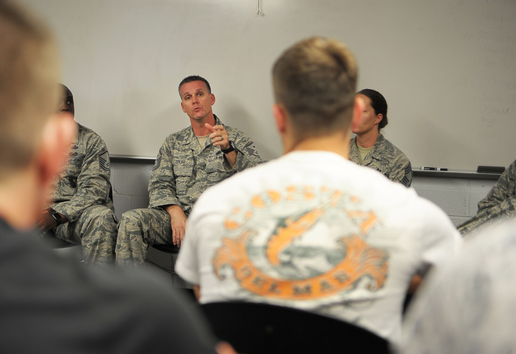 Master Sgt. Shawn Tolar, the first sergeant assigned to the 6th Force Support Squadron, answers a question asked by an Air Force ROTC cadet during a visit to the University of Florida’s Detachment 150, March 28, 2017. Tolar, as well as five other senior NCOs from MacDill Air Force Base, teamed up to give advice to more than 15 cadets. (U.S. Air Force photo by Airman 1st Class Adam R. Shanks)