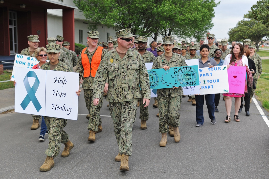 Sailors assigned to Navy Expeditionary Combat Command and Expeditionary Warfighting Development Center participate in a walking event for Sexual Assault Awareness month.