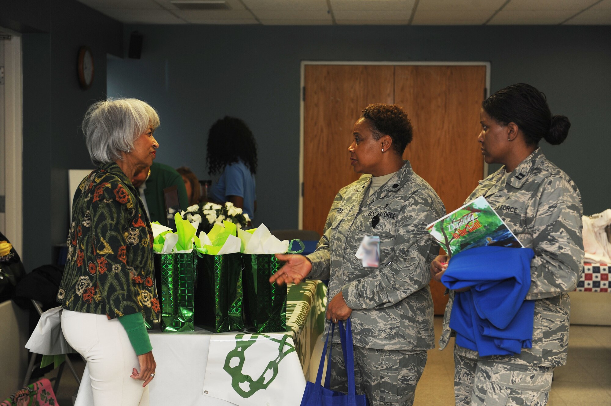 Lt. Col. Jacqueline Berry, 375th Medical Group health care integrator talks with Carletta Harlan, Gateway of the Links Incoporated member, at a women's resiliency fair March 23 at Scott Air Force Base. Representatives from different agencies, aimed at helping women with their mental health, spiritual health, and physical health, gathered at the base chapel to provide assistance to Team Scott members and raise awareness on issues facing women. (U.S. Air Force photo by Tech. Sgt. Maria Castle)