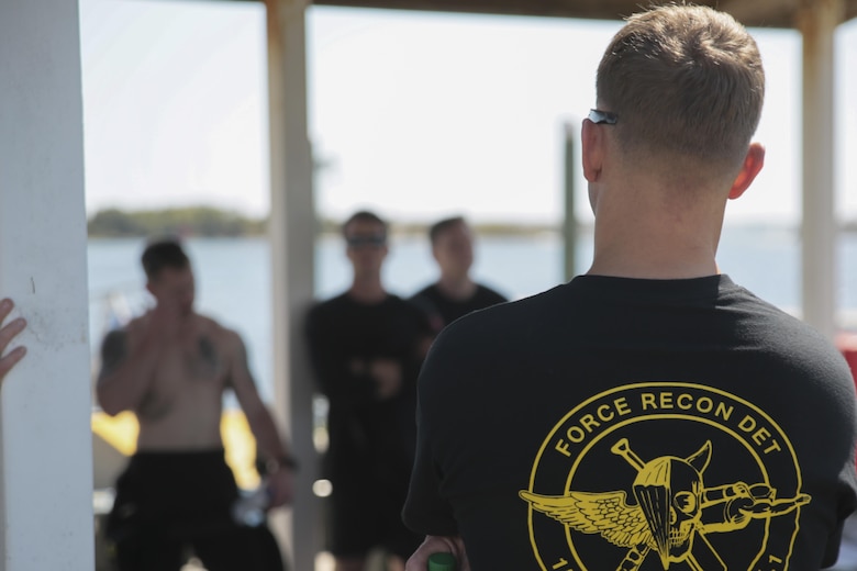 Staff Sgt. Hunter Stafford, dive chief with 3rd Force Reconnaissance Company, 4th Marine Division, conducts a dive brief as part of the day and night dive and ship-to-shore advancement operation at Pensacola, Fla., March 22, 2017. The exercise focused on performing sustainment training on Marine combative dive tactics. The training will enhance the company’s capability conduct specialized insertion and extraction tasks. (U.S. Marine Corps photo by Sgt. Ian Ferro)