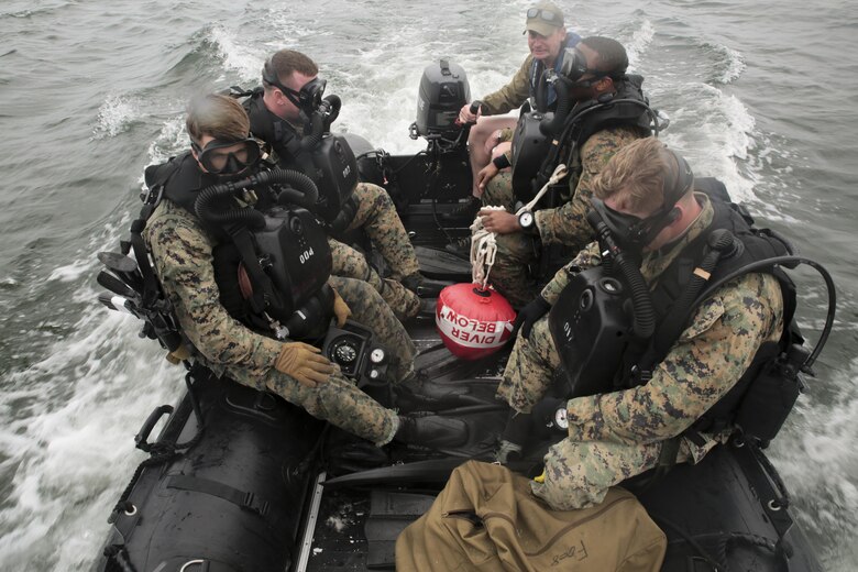 Marines with 3rd Force Reconnaissance Company ride aboard the combat rubber raiding craft toward an open water deployment during a ship-to-shore diving operation exercise at Pensacola, Fla., March 23, 2017. The exercise focused on performing sustainment training on Marine combative dive tactics. The training will enhance the company’s capability conduct specialized insertion and extraction tasks. (U.S. Marine Corps photo by Sgt. Ian Ferro)
