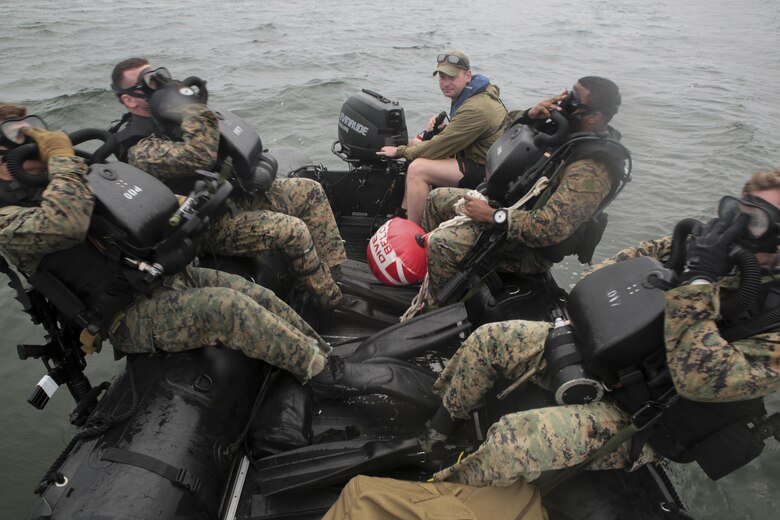 Marines with 3rd Force Reconnaissance Company enter the water during a ship-to-shore diving operation exercise at Pensacola, Fla., March 23, 2017. The exercise focused on performing sustainment training on Marine combative dive tactics. The training will enhance the company’s capability conduct specialized insertion and extraction tasks. (U.S. Marine Corps photo by Sgt. Ian Ferro)