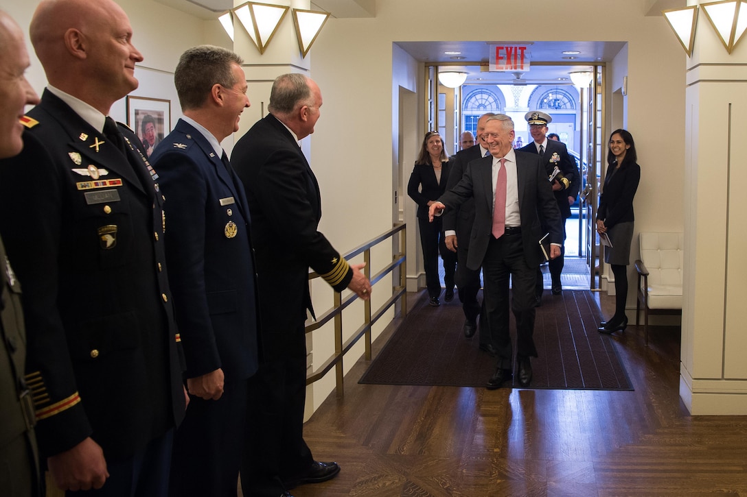 >Defense Secretary Jim Mattis greets commissioned officers.
