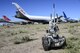 A U.S. Air Force Medium-Sized Robot prepares to approach an improvised explosive device during the Raven's Challenge XI Interoperability Exercise at Pinal Airpark in Marana, Ariz., March 21, 2017. Pinal Airpark is a commercial airliner scrapyard, which provides an optimal military training environment. (U.S. Air Force photo by Airman 1st Class Nathan H. Barbour)