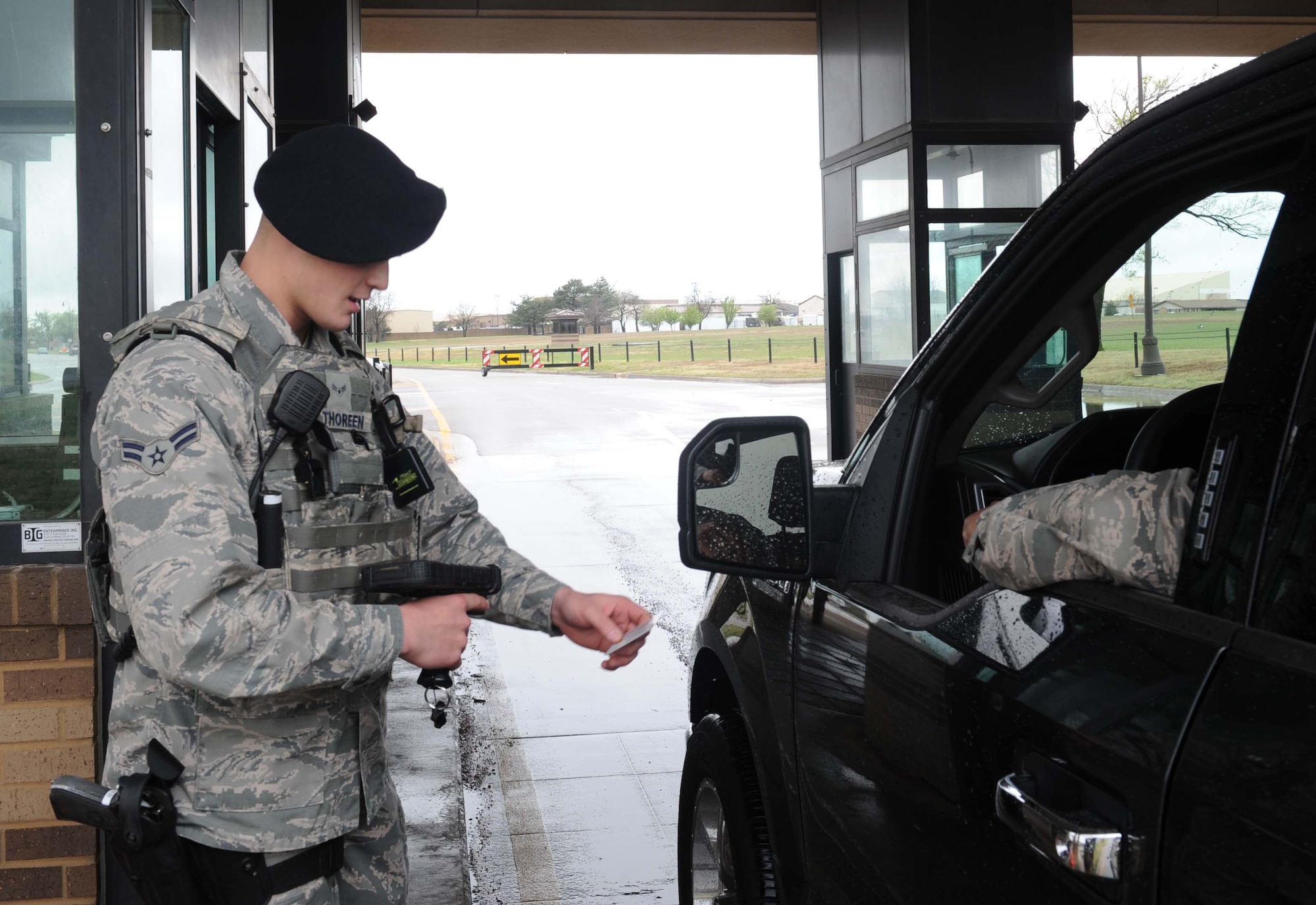 Airman 1st Class Austin Thoreen, 22nd Security Forces Squadron entry controller, scans a military ID March 29, 2017, at McConnell Air Force Base, Kan. The Department of Defense prohibits personnel from using a military ID to gain base access when doing so for personal commercial gain. (U.S. Air Force photo/Senior Airman Tara Fadenrecht)