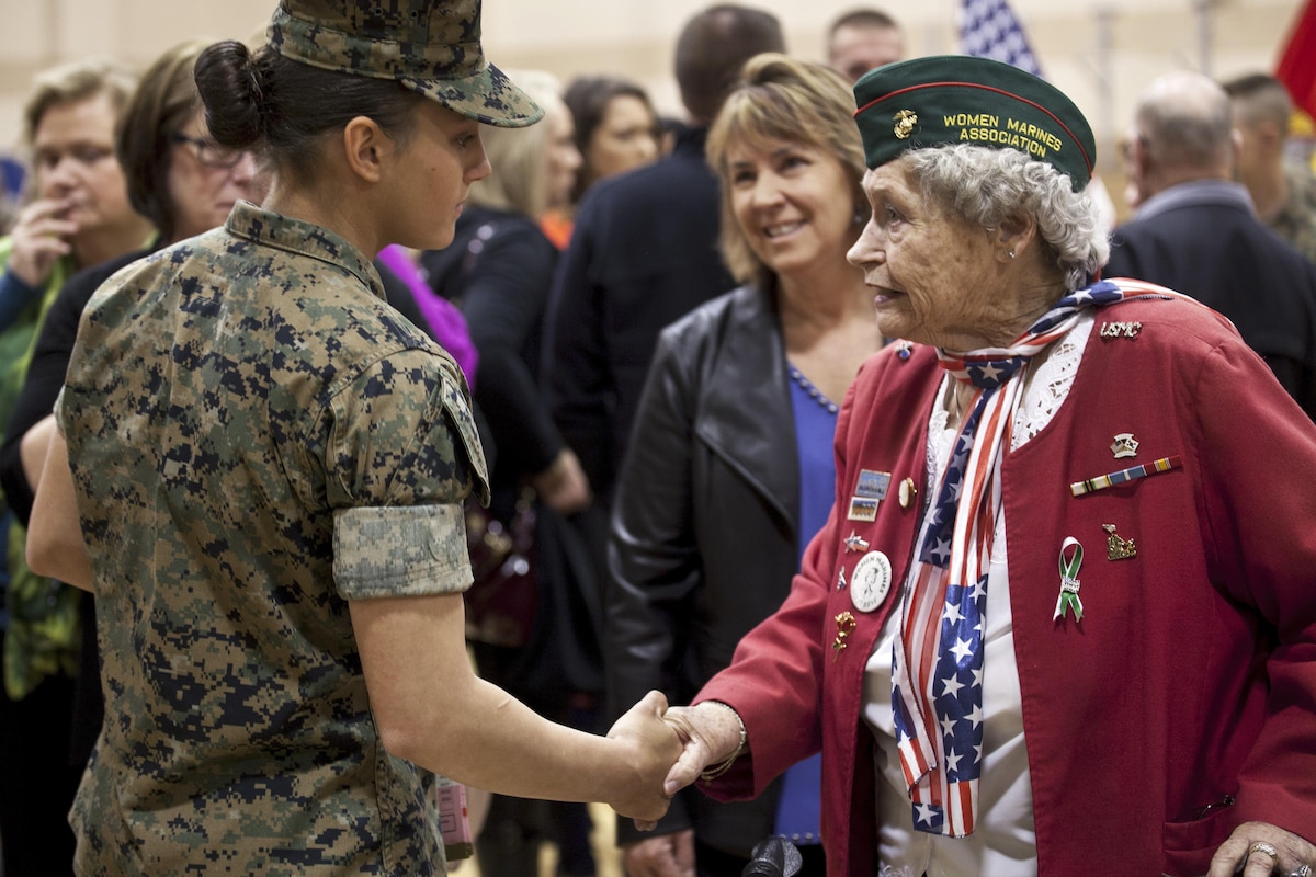 Marine Corps Pfc. Maria Daume, left, receives a congratulatory handshake after graduating from the basic mortarman course at Marine Corps Base Camp Geiger, N.C., March 23, 2017. Daume is a mortarman assigned to Bravo Company, Infantry Training Battalion, School of Infantry East. Mortarmen provide fire to support maneuver elements using light, medium and heavy mortars. Marine Corps photo by Cpl. Laura Mercado