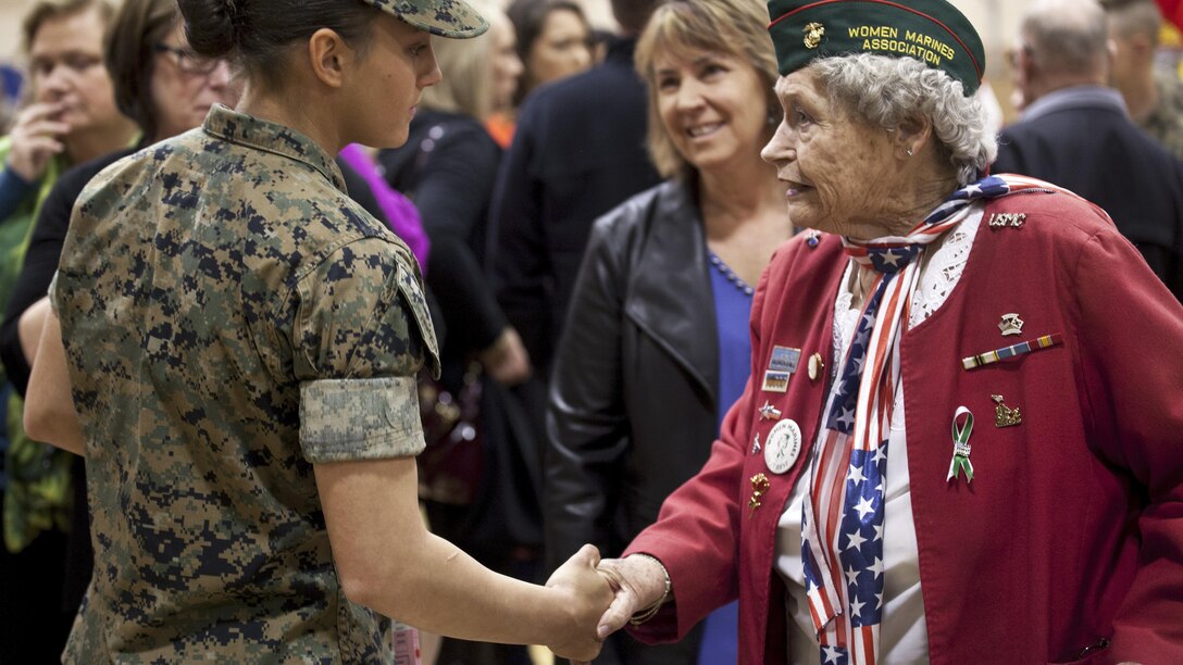 Marine Corps Pfc. Maria Daume, left, receives a congratulatory handshake after graduating from the basic mortarman course at Marine Corps Base Camp Geiger, N.C., March 23, 2017. Daume is a mortarman assigned to Bravo Company, Infantry Training Battalion, School of Infantry East. Mortarmen provide fire to support maneuver elements using light, medium and heavy mortars. Marine Corps photo by Cpl. Laura Mercado