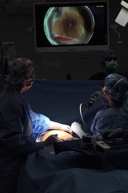 Maj. Lauren Buck, 81st Surgical Operations Squadron general surgeon, and a surgical technician perform a da Vinci ventral hernia repair, March 28, 2017, on Keesler Air Force Base, Miss. This was the first robotic surgery in the Air Force. The robotic system enhances surgeon’s mobility and range of motion.(U.S. Air Force photo by Senior Airman Jenay Randolph)
