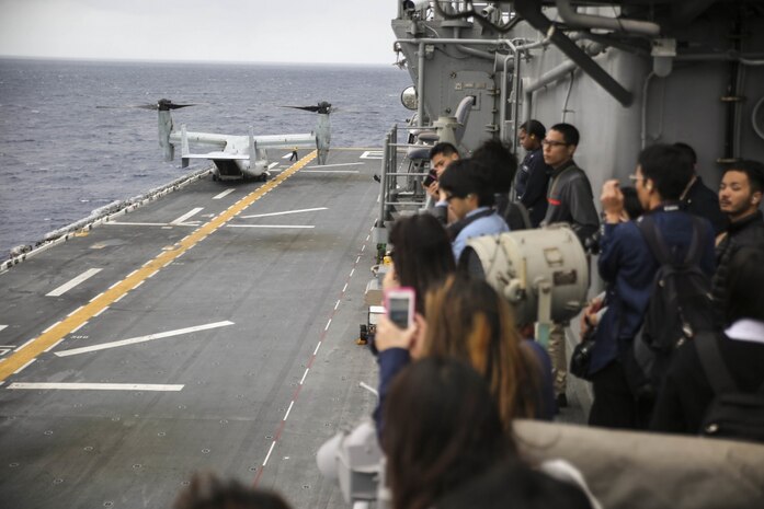 College students from Okinawa, Japan watch a Marine MV-22B Osprey land aboard the USS Bonhomme Richard (LHD 6) in the Pacific Ocean, March 25, 2017. College students from Okinawa International University, Ryukyu University and Toyo Medical Community College toured the USS Bonhomme Richard (LHD 6) as part of a military exchange experience during the 31st Marine Expeditionary Unit’s 17.1 Spring Patrol of the Indo-Asia-Pacific region. Education programs, such as this military exchange experience, increase cooperation, trust and understanding between the U.S. military and the Okinawan community. As the Marine Corps’ only continuously forward deployed unit, the 31st Marine Expeditionary Unit’s air-ground-logistics team provides a flexible force, ready to perform a wide range of military operations, from limited combat to humanitarian assistance operations, throughout the Asia-Pacific region. 