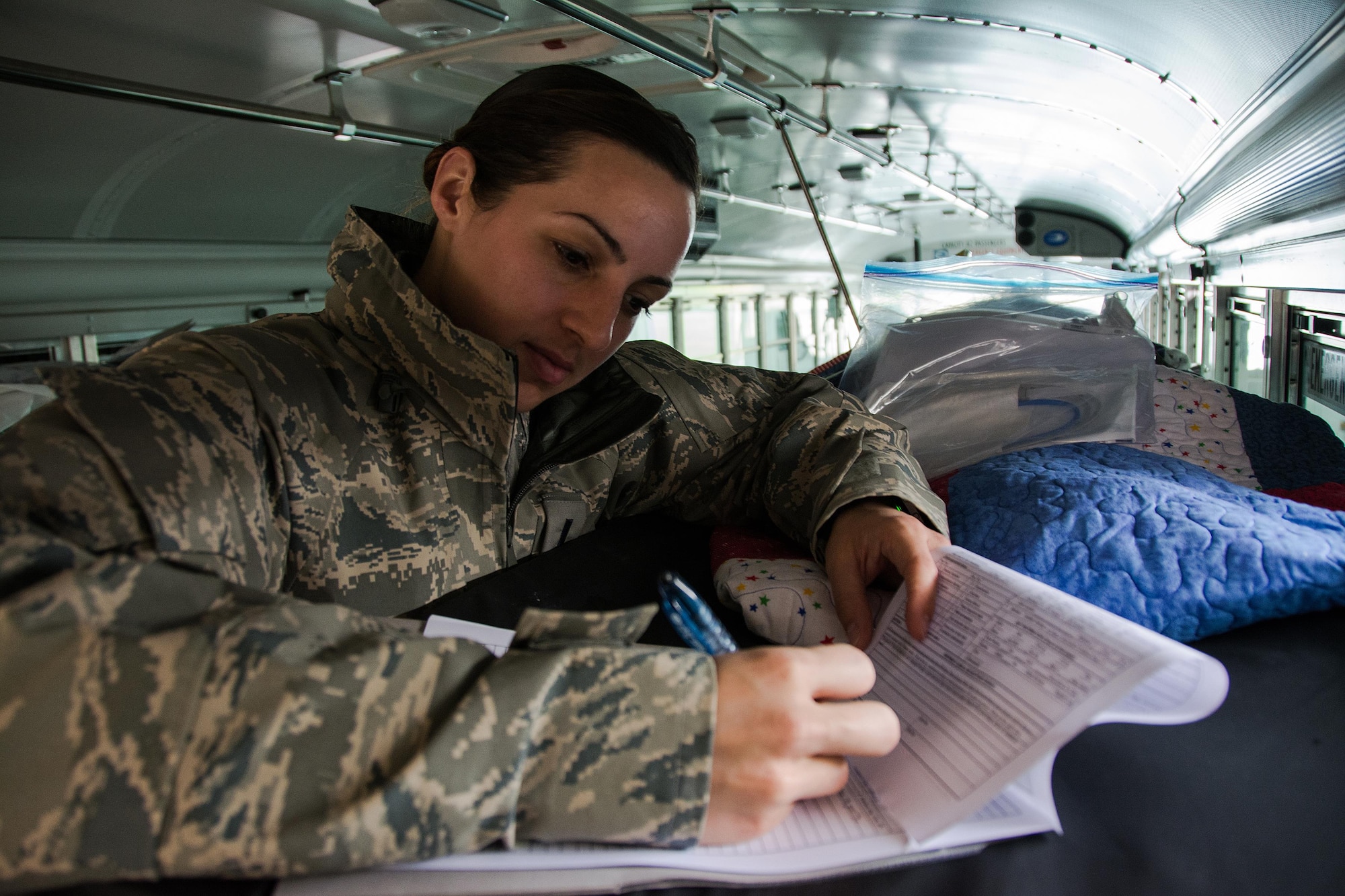 1st Lt. Christine Aye, 60th Inpatient Squadron nurse, goes over a “patient’s” paper work during Patriot Delta at Travis Air Force Base, Calif. on March 24, 2017. Members of the 60th IPTS participated in the Air Force Reserve exercise Patriot Delta, providing enroute patient care and staging the medical manikins. (U.S. Air Force photo by Staff Sgt. Daniel Phelps)