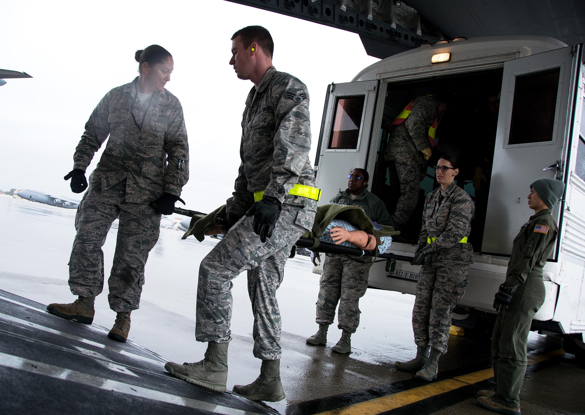 Patriot Delta participants carry a litter with a medical manikin patient off of an ambulance bus onto a C-17 Globemaster III during Patriot Delta at Travis Air Force Base, Calif. on March 24, 2017. Patriot Delta brought in aeromedical evacuations squadrons from the from the 911th Airlift Wing at Pittsburgh Air Reserve Station, Penn., the 908th AW at Maxwell Air Force Base, Miss.; the 932d Airlift Wing at Scott AFB, Ill.; and the 349th Air Mobility Wing at Travis AFB. (U.S. Air Force photo by Staff Sgt. Daniel Phelps)