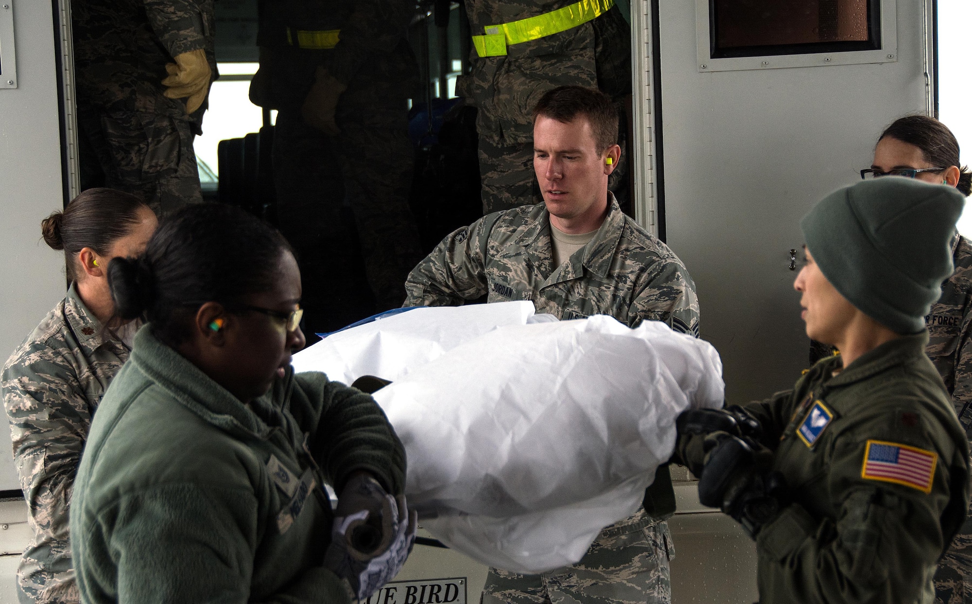 Patriot Delta participants carry a litter with a medical manikin patient onto a C-17 Globemaster III during Patriot Delta at Travis Air Force Base, Calif. on March 24, 2017. Patriot Delta brought in aeromedical evacuations squadrons from the from the 911th Airlift Wing at Pittsburgh Air Reserve Station, Penn., the 908th AW at Maxwell Air Force Base, Miss.; the 932d Airlift Wing at Scott AFB, Ill.; and the 349th Air Mobility Wing at Travis AFB. (U.S. Air Force photo by Staff Sgt. Daniel Phelps)
