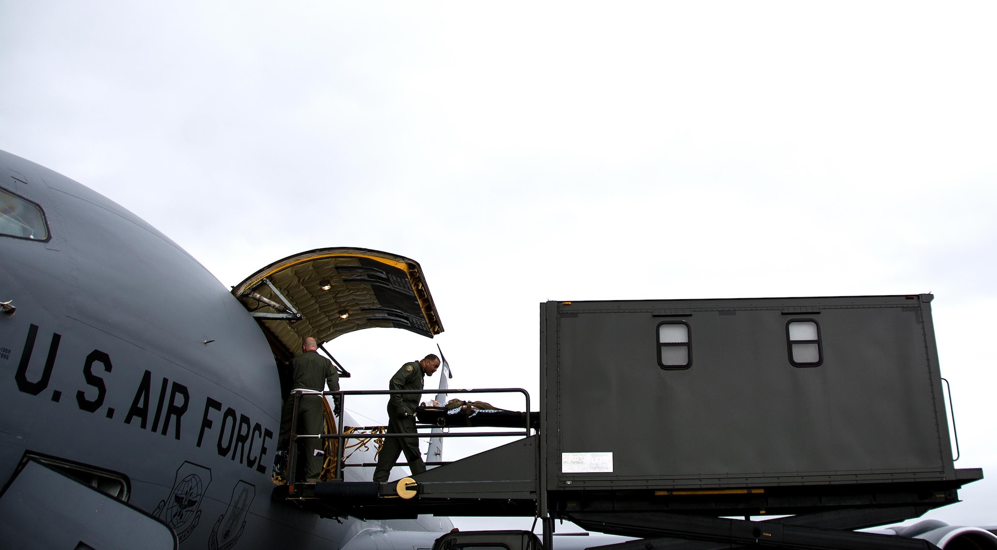 Master Sgt. Rard Perkins, 911th Operations Group aircrew trainer, offloads a patient onto a specialized medical K loader during Patriot Delta at Travis Air Force Base, Calif. on March 24, 2017. Patriot Delta brought in aeromedical evacuations squadrons from the from the 911th Airlift Wing at Pittsburgh Air Reserve Station, Penn., the 908th AW at Maxwell Air Force Base, Miss.; the 932d Airlift Wing at Scott AFB, Ill.; and the 349th Air Mobility Wing at Travis AFB. (U.S. Air Force photo by Staff Sgt. Daniel Phelps)