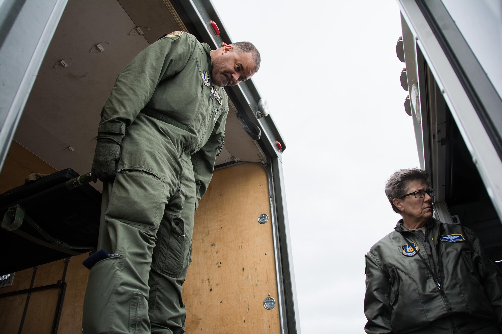 Master Sgt. Rard Perkins, 911th Operations Group aircrew trainer, prepares to offload a patient from a specialized medical K loader onto an ambulance bus, while Chief Master Sgt. Laura Nepute, 349th Aeromedical Evacuation Squadron chief enlisted manager, ensures patients are safely secured during Patriot Delta at Travis Air Force Base, Calif. on March 24, 2017. Patriot Delta brought in aeromedical evacuations squadrons from the from the 911th Airlift Wing at Pittsburgh Air Reserve Station, Penn., the 908th AW at Maxwell Air Force Base, Miss.; the 932d Airlift Wing at Scott AFB, Ill.; and the 349th Air Mobility Wing at Travis AFB. (U.S. Air Force photo by Staff Sgt. Daniel Phelps)