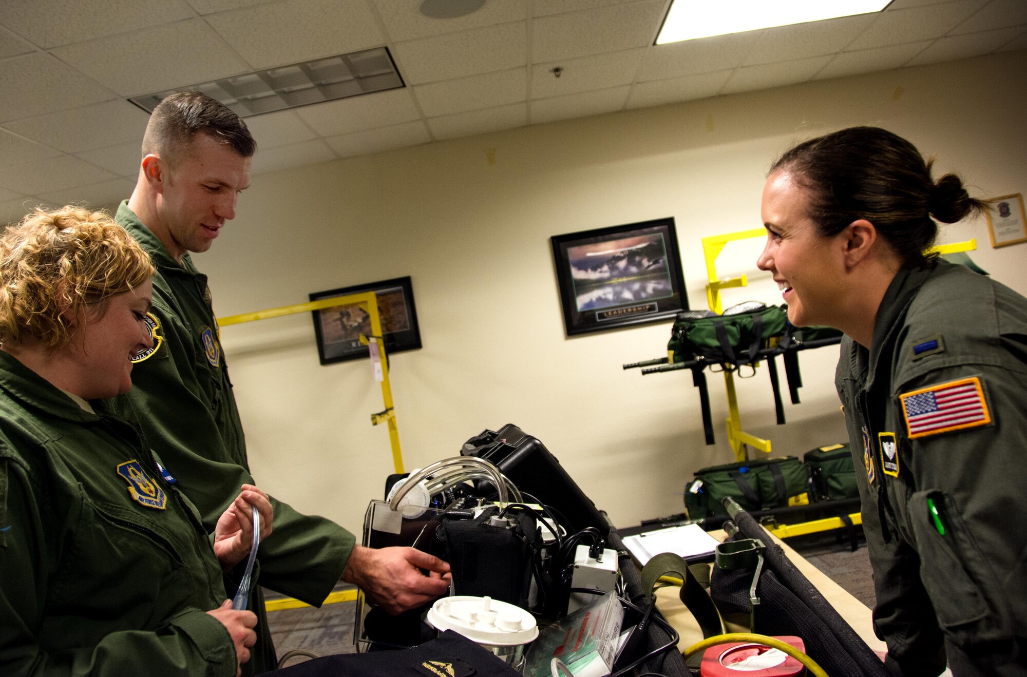 Tech. Sgt. Brandi Seibel, 932nd Aeromedical Evacuation Squadron medical technician, Staff Sgt. Tyler Port, 911th AES medical technician, and 1st Lt. Ashley Stough, 911th AES flight nurse, discuss the mechanics of an impact suction unit during Patriot Delta at Travis Air Force Base, Calif. on March 24, 2017. Patriot Delta brought in aeromedical evacuations squadrons from the from the 911th Airlift Wing at Pittsburgh Air Reserve Station, Penn., the 908th AW at Maxwell Air Force Base, Miss.; the 932d Airlift Wing at Scott AFB, Ill.; and the 349th Air Mobility Wing at Travis AFB. (U.S. Air Force photo by Staff Sgt. Daniel Phelps)