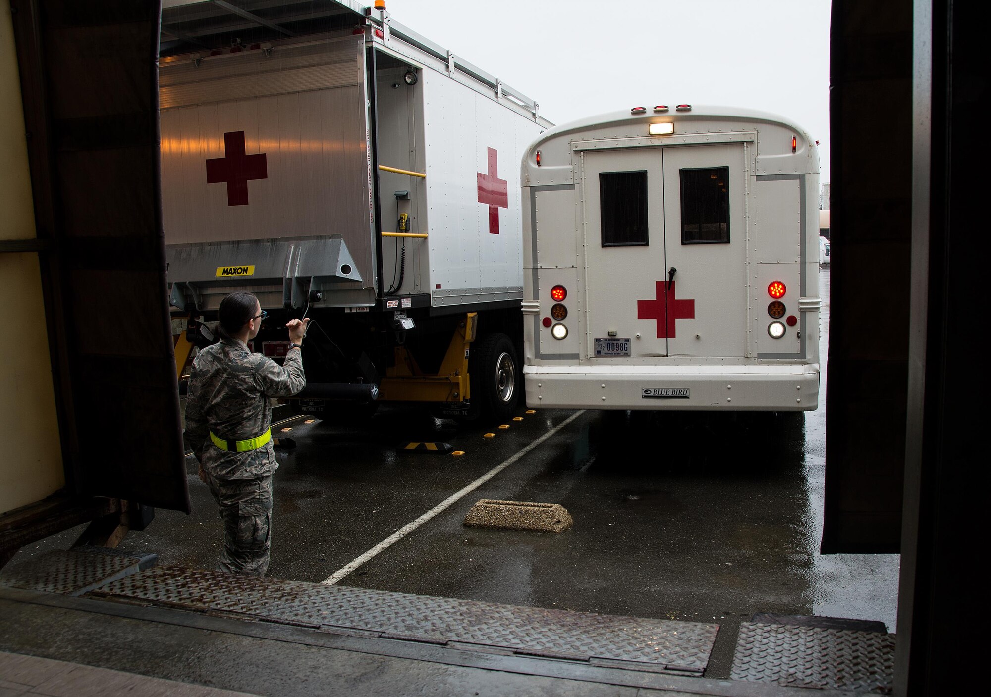 1st Lt. Andrea Nofi, 60th Inpatient Squadron nurse, guides an ambulance bus to the edge of a loading dock at David Grant U.S. Air Force Medical Center at Travis Air Force Base, Calif., on March 24, 2017. Members of the 60th IPTS participated in the Air Force Reserve exercise Patriot Delta, providing enroute patient care. (U.S. Air Force photo by Staff Sgt. Daniel Phelps)