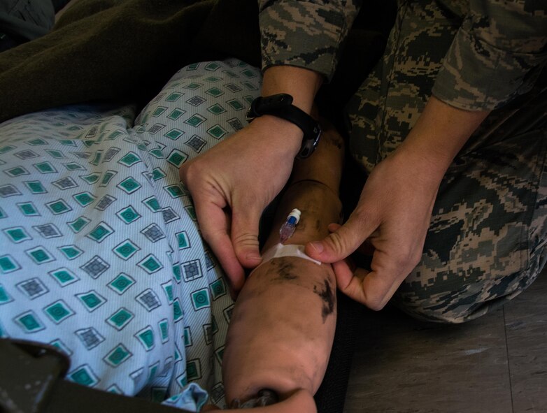 1st Lt. Andrea Nofi, 60th Inpatient Squadron nurse, stages a medical manikin at David Grant U.S. Air Force Medical Center at Travis Air Force Base, Calif., on March 24, 2017. Members of the 60th IPTS participated in the Air Force Reserve exercise Patriot Delta, providing enroute patient care and staging the medical manikins. (U.S. Air Force photo by Staff Sgt. Daniel Phelps)