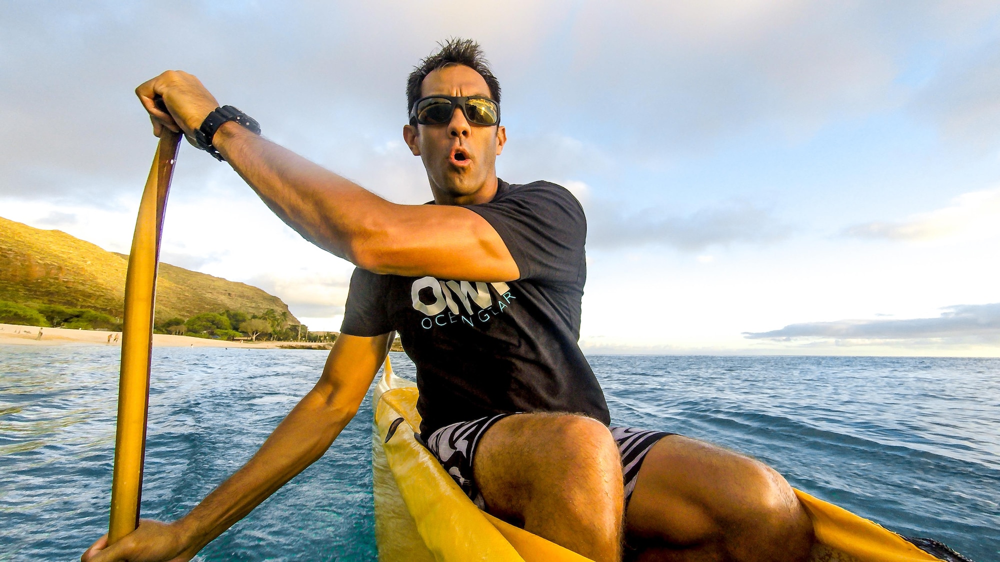 Then Tech. Sgt. Alfred Van Gieson, now Master Sgt., a reservist with the 48th Aerial Port Squadron, 624th Regional Support Group, Joint Base Pearl Harbor-Hickam, coaches the crew of a six-man outrigger canoe of the Leeward Kai Canoe Club in the waters off Kalaianaole Beach Park in Nanakuli, Oahu, Hawaii, Aug 11, 2016. Van Gieson is a veteran of Operation Iraqi Freedom, a world champion outrigger, or Va'a, paddler and the coach at the Leeward Kai Canoe Club, which was founded by his grandparents. (U.S. Air Force photo by J.M. Eddins Jr.)