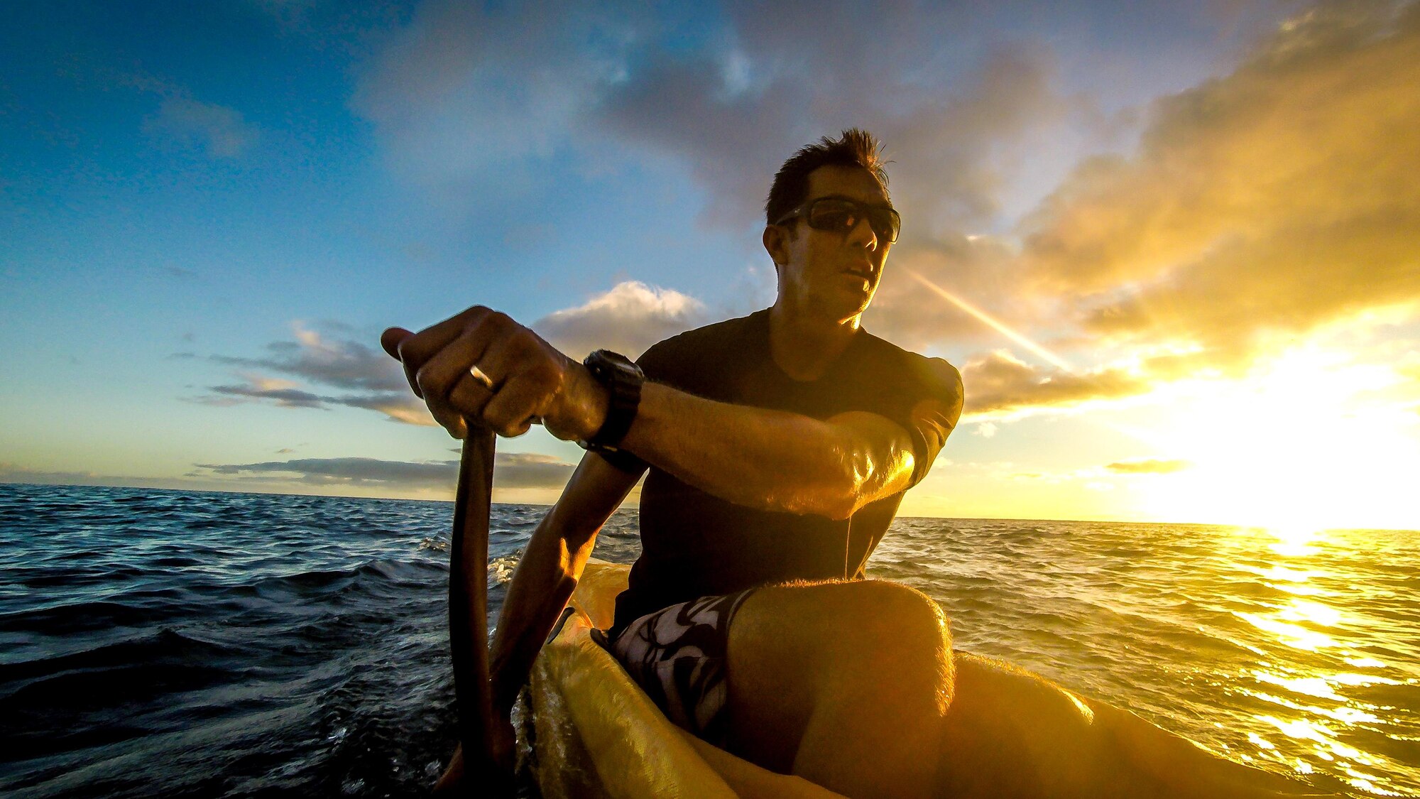 Then Tech. Sgt. Alfred Van Gieson, now Master Sgt., a reservist with 48th Aerial Port Squadron, 624th Regional Support Group, Joint Base Pearl Harbor-Hickam, coaches the crew of a six-man outrigger canoe of the Leeward Kai Canoe Club in the waters off Kalaianaole Beach Park in Nanakuli, Oahu, Hawaii, Aug 11, 2016. Van Gieson is a veteran of Operation Iraqi Freedom, a world champion outrigger, or Va'a, paddler and the coach at the Leeward Kai Canoe Club, which was founded by his grandparents. (U.S. Air Force photo by J.M. Eddins Jr.)