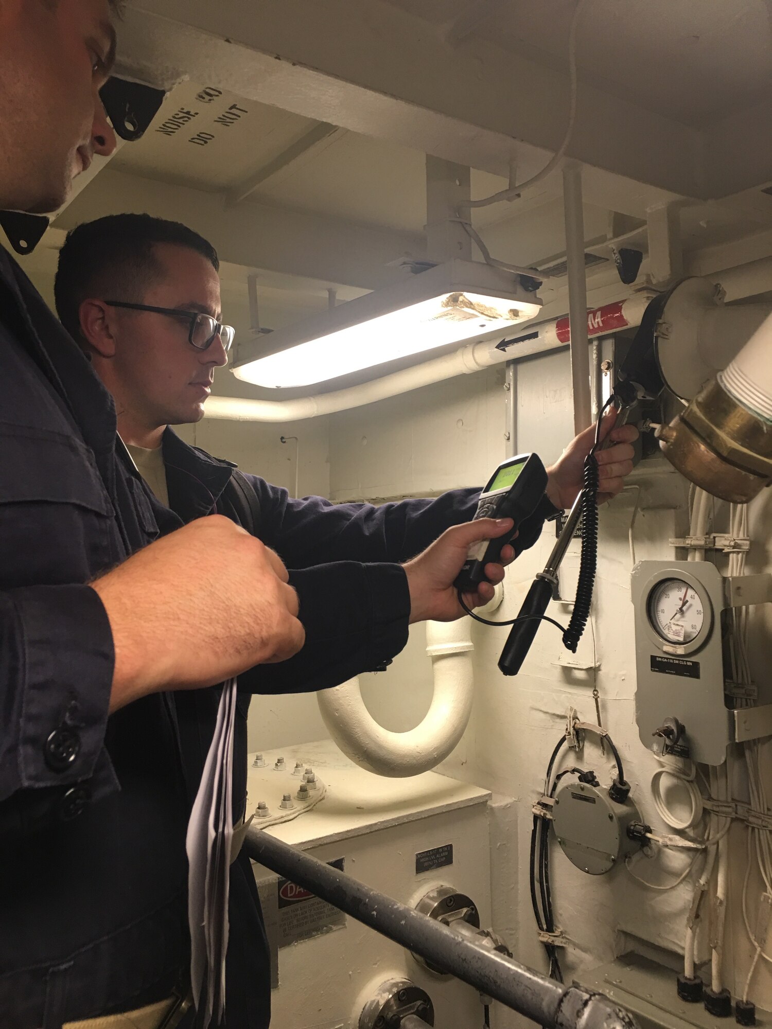 US Air Force Airman 1st Class Derrik Fleton, bioenvironmental engineering technician, measures the air circulation aboard the Preble. (Courtesy Photo)