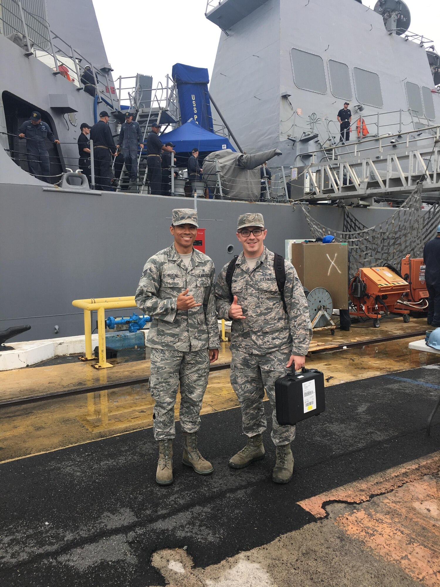U.S. Air Force Senior Airman Raphy Feolino and Airman 1st Class Derrik Fleton, bioenvironmental engineering technicians, supported the Navy Environmental and Preventative Medicine Unit 6 by conducting ventilation surveys aboard the Preble.  (Courtesy Photo)
