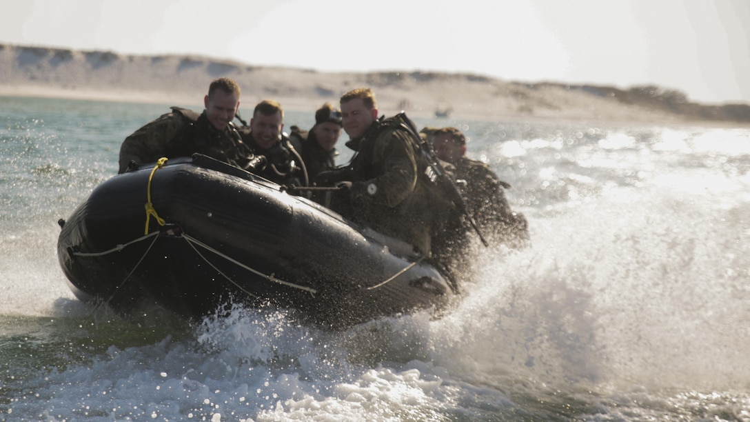 Marines with 3rd Force Reconnaissance Company ride aboard a combat rubber raiding craft toward an open water site during a ship-to-shore diving operation exercise at Pensacola, Fla., March 22, 2017. The exercise focused on performing sustainment training on Marine combative dive tactics. The training will enhance the company’s capability conduct specialized insertion and extraction tasks.