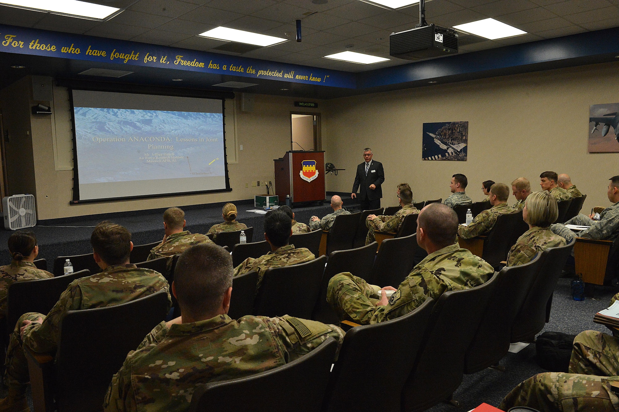 An instructor from Air University’s LeMay Center begins a lesson with Rear Mission Support Element course students at Shaw Air Force Base, S.C., Feb. 21, 2017. The four-week course provides two weeks of in-class instruction on military doctrine, joint operation planning, course of action development and OIR specific products. (U.S. Air Force photo by Senior Airman Diana M. Cossaboom)
