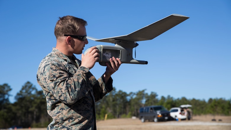 Sgt. Dillon Emery checks a Raven small unmanned aircraft system’s components to ensure it is ready to fly at Marine Corps Base Camp Lejeune, N.C., March 27, 2017. Marines conducted aerial training exercises at Tactical Landing Zone Dove to demonstrate the capabilities and build familiarization with the SUAS. Emery is an intelligence specialist with 2nd Battalion, 8th Marine Regiment. 