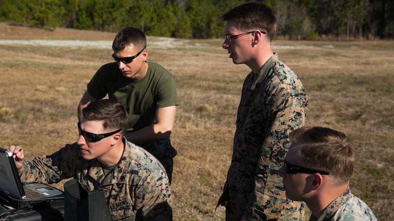 Marines conduct final preparations to a Raven small unmanned aircraft system before its launch at Marine Corps Base Camp Lejeune, N.C., March 27, 2017. Marines conducted aerial training exercises at Tactical Landing Zone Dove to demonstrate the capabilities and build familiarization with the SUAS. The Marines are with 2nd Battalion, 8th Marine Regiment. 