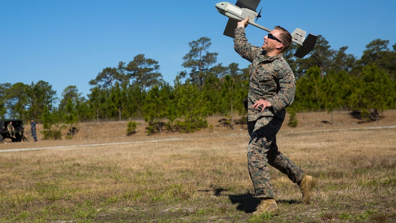Sgt. Dillon Emery launches a Raven small unmanned aircraft system at Marine Corps Base Camp Lejeune, N.C., March 27, 2017. Marines conducted aerial training exercises at Tactical Landing Zone Dove to demonstrate the capabilities and build familiarization with the SUAS. Emery is an intelligence specialist with 2nd Battalion, 8th Marine Regiment. 