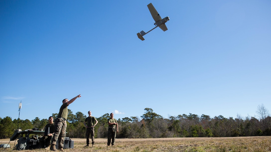 A Marine launches a Raven small unmanned aircraft system into the air at Marine Corps Base Camp Lejeune, N.C., March 27, 2017. Marines conducted aerial training exercises at Tactical Landing Zone Dove to demonstrate the capabilities and build familiarization with the SUAS. The Marines are intelligence specialists with 2nd Battalion, 8th Marine Regiment. 